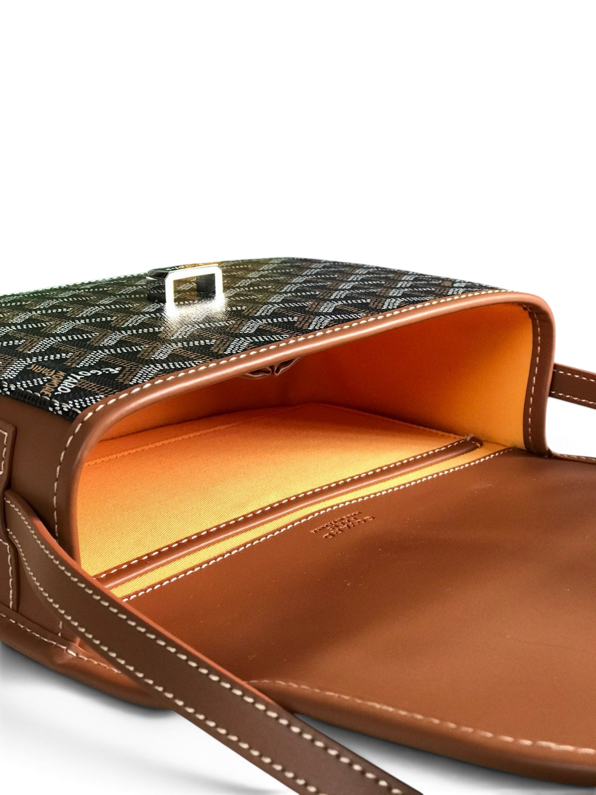 SWORD LUXURY Belvédère II messenger bag in Goyardine canvas with brown leather trim and bright orange interior lining.