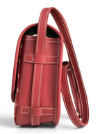 SWORD LUXURY Belvédère II messenger bag in red leather with white contrast stitching, side view showing strap detail.
