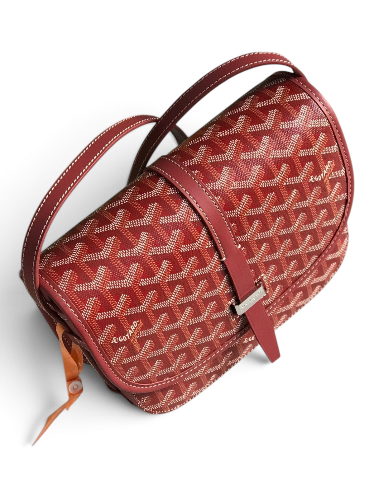 SWORD LUXURY Belvédère II messenger bag in red Goyardine canvas with leather trim, adjustable strap, and metal buckle.