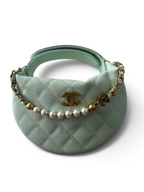 SWORD LUXURY nane rengi kapitone deri mini hobo çanta, inci detaylı zincir ve altın renkli logo süslemeli.