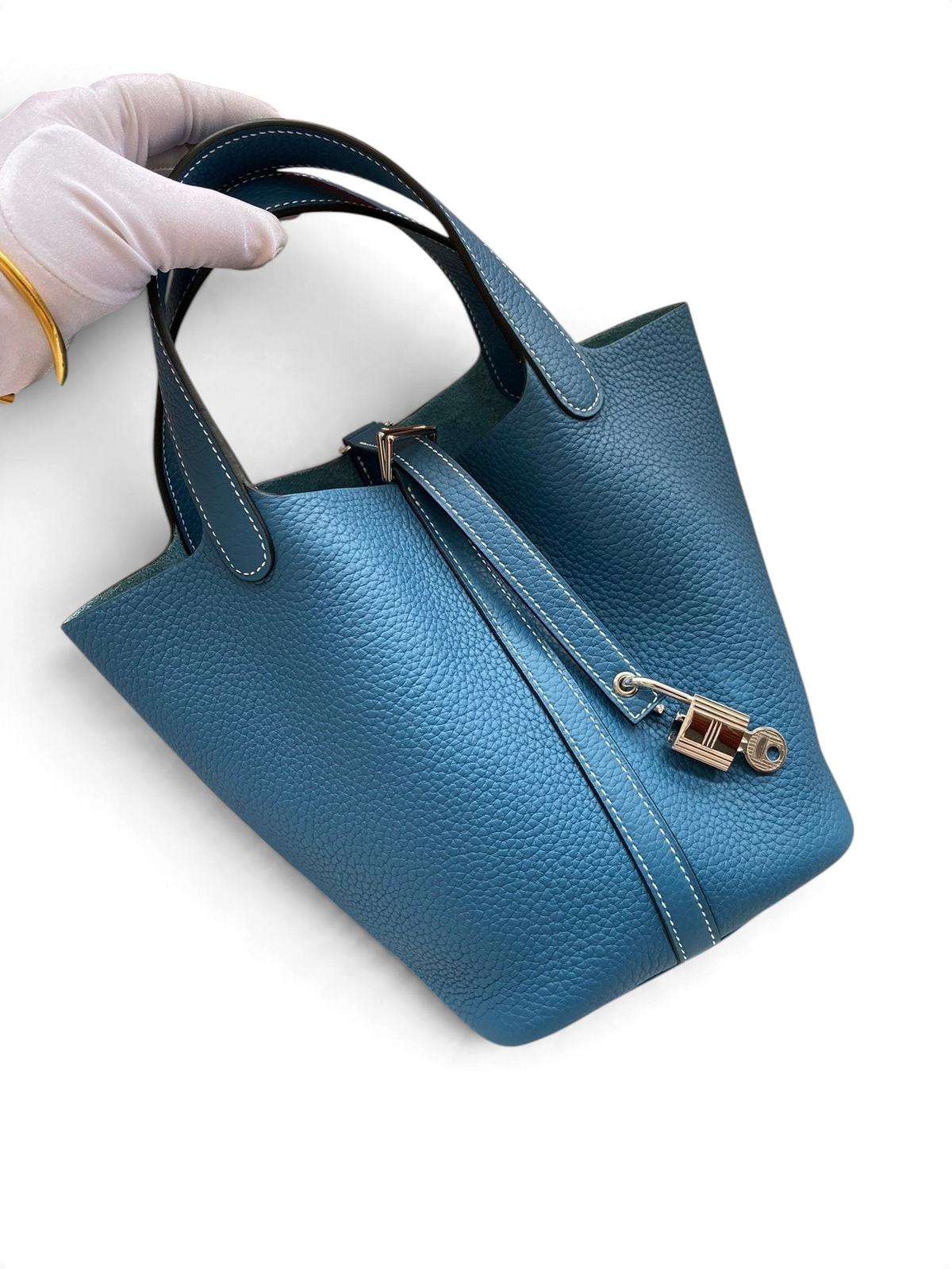 SWORD LUXURY mavi Clemence deri Picotin 18 çanta, gümüş tonlu asma kilit detayı ve çift saplı minimalist tasarım.