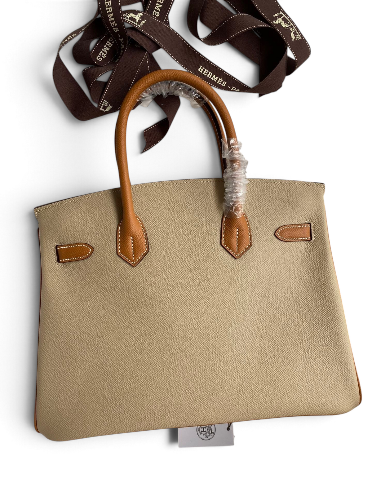 SWORD LUXURY marka, iki tonlu bej ve taba renkli, Epsom deri Hermès Birkin 25cm çanta, kutu içinde.