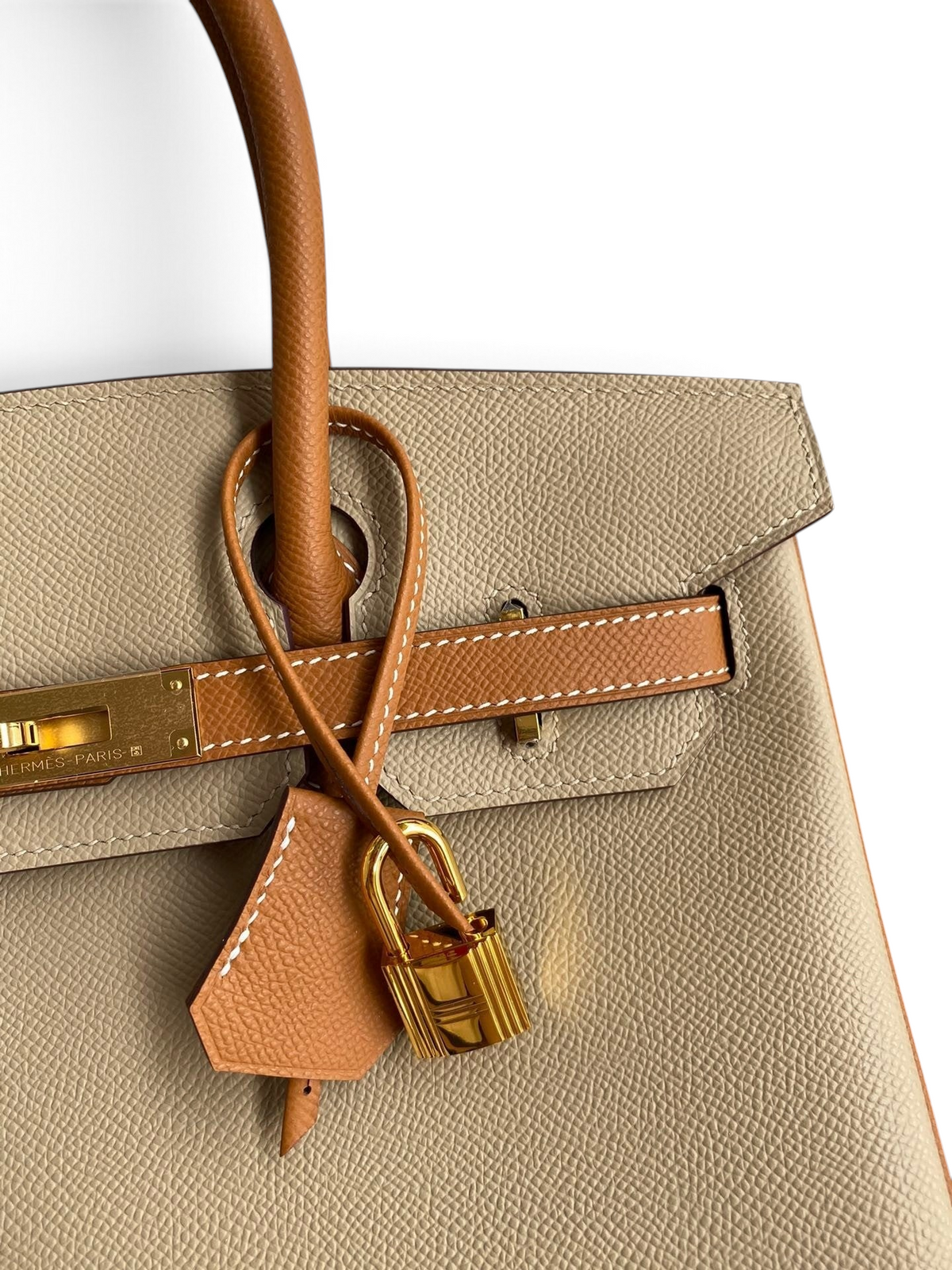 SWORD LUXURY marka, iki tonlu bej ve taba rengi Epsom deri Hermès Birkin 25cm çanta, altın rengi kilit detaylı.