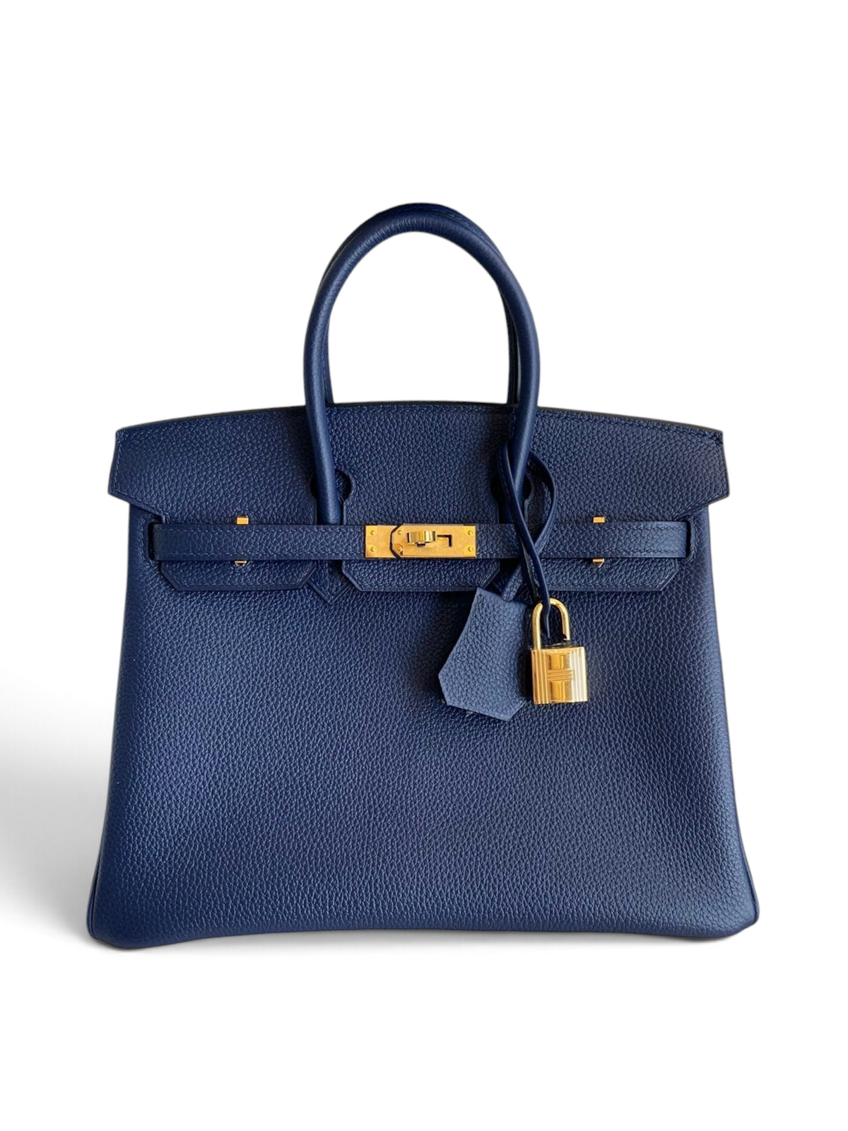 SWORD LUXURY lacivert Togo deri Hermès Birkin 25cm çanta, altın rengi donanım ve kilit detaylı.