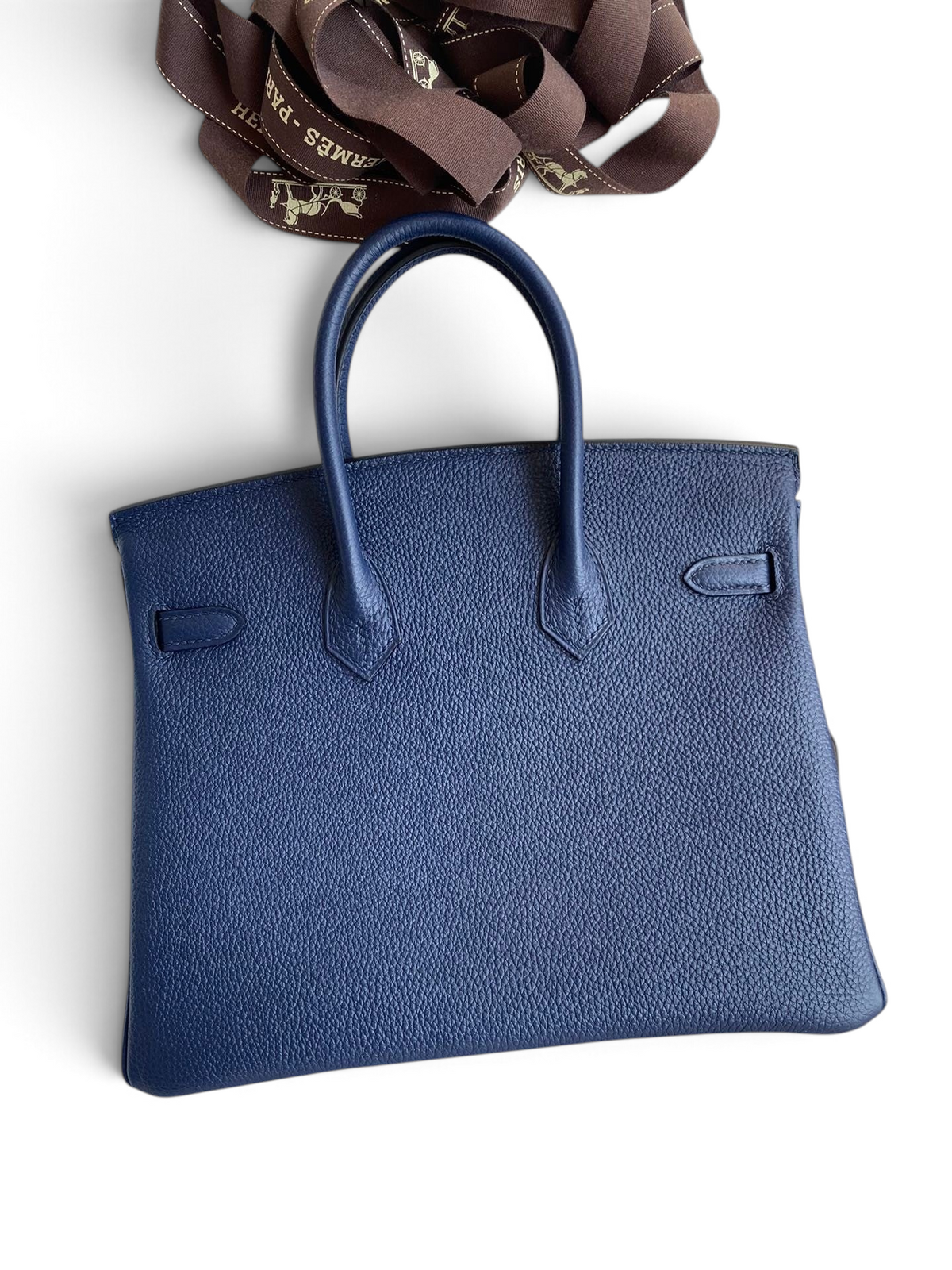 SWORD LUXURY lacivert Togo deri Hermès Birkin 25cm çanta, kutu içerisinde şık ve dokulu tasarımıyla.