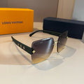 Louis Vuitton sunglasses with a box in the background