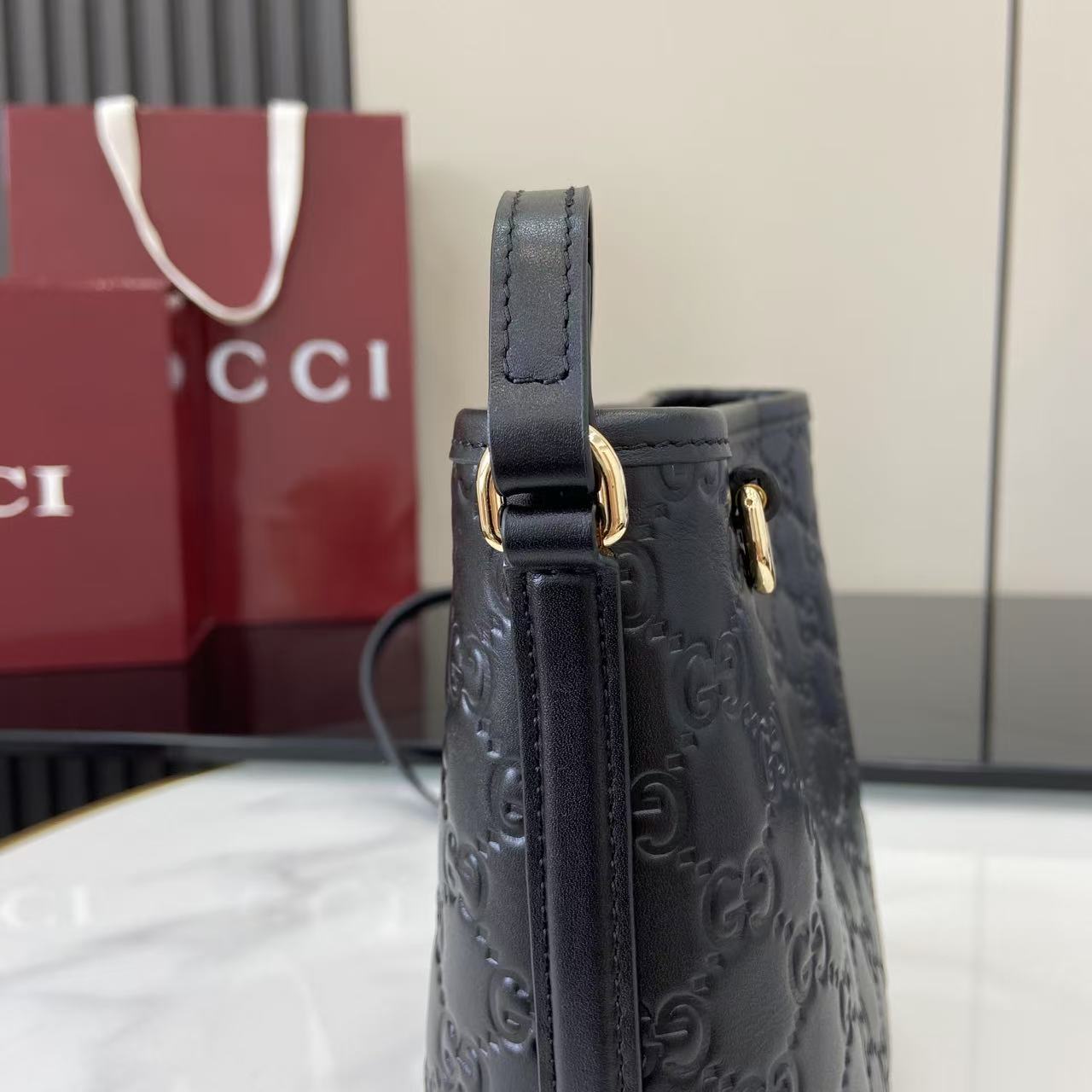 GG Emblem Mini Black Leather Crossbody Bag