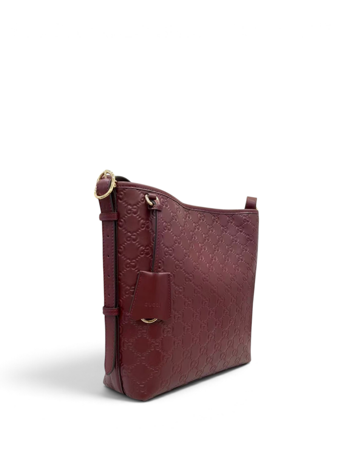 SWORD LUXURY bordo renkli, GG monogram kabartmalı deri omuz çantası, ayarlanabilir askılı ve şık tasarımlı.