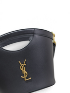SWORD LUXURY siyah deri Cassandra mini çanta, altın renkli YSL monogram detaylı ve zarif kesim saplı tasarım.