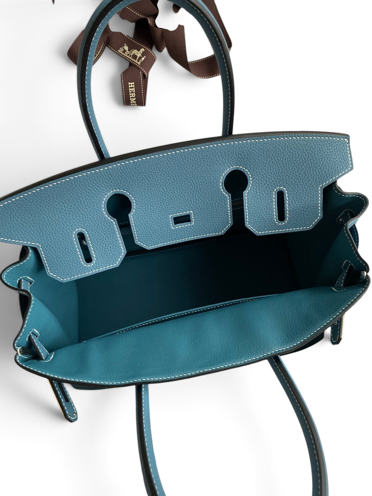SWORD LUXURY marka, mavi Togo deriden üretilmiş, iç kısmı görünen 30 cm boyutunda ikonik Hermès Birkin çanta.