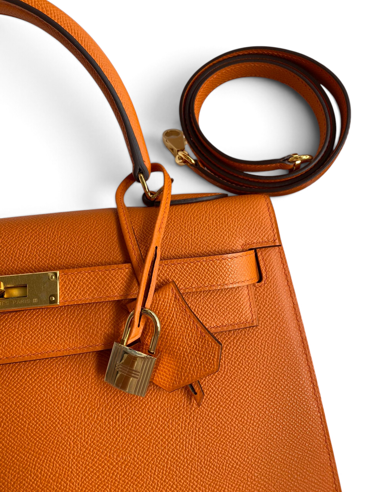 SWORD LUXURY turuncu Epsom deri Hermès Kelly 32cm çanta, altın donanım, kilit ve çıkarılabilir omuz askısı detaylı.