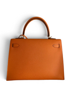 SWORD LUXURY turuncu Epsom deri Hermès Kelly 32cm çanta, kutu içinde omuz askısı ve detaylarıyla birlikte.
