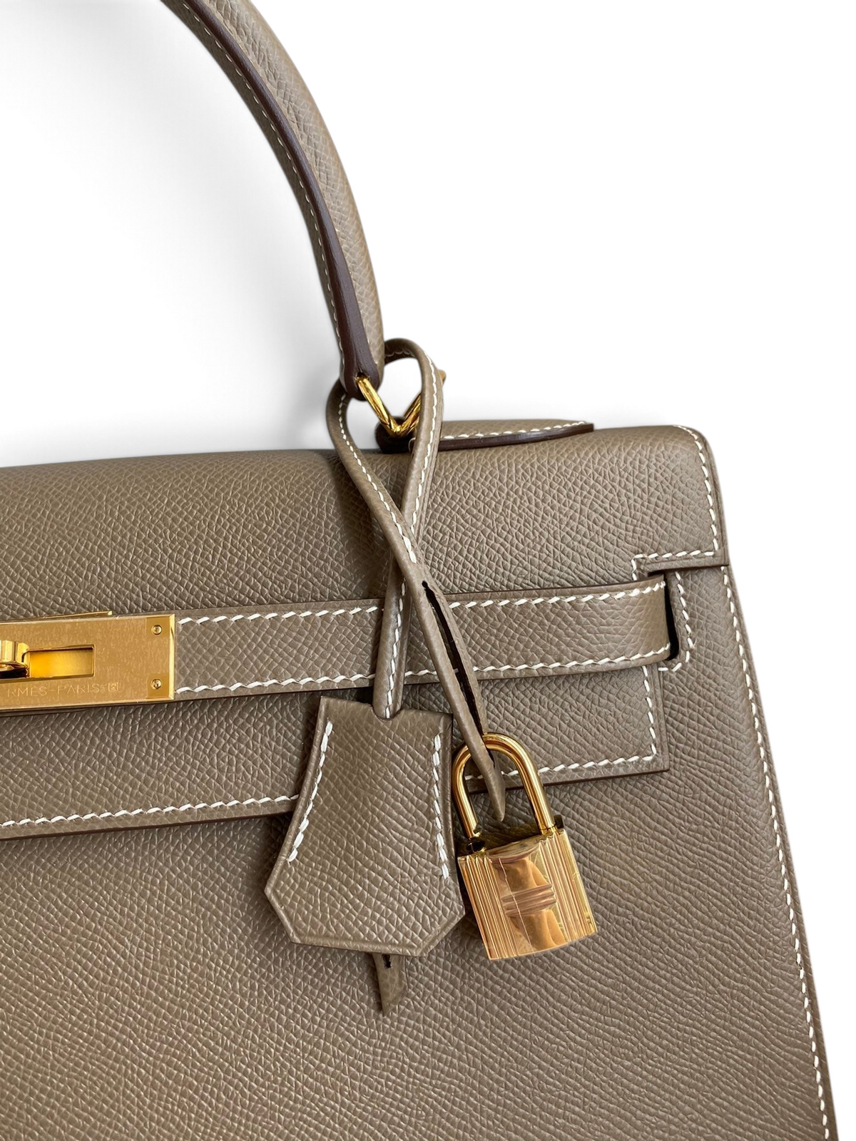 SWORD LUXURY marka, gri Epsom deri Hermès Kelly 32cm çanta, altın rengi kilit ve detaylara sahip.