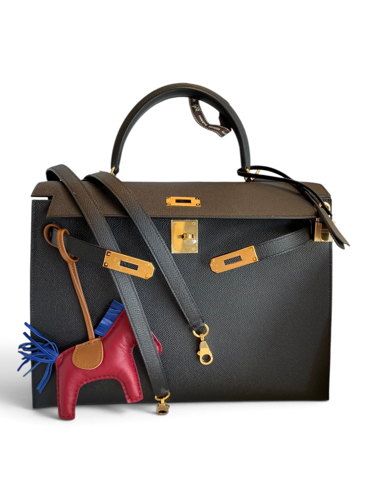 SWORD LUXURY siyah Epsom deri Hermès Kelly 32cm çanta, altın donanım ve çıkarılabilir omuz askısı ile kutusunda.