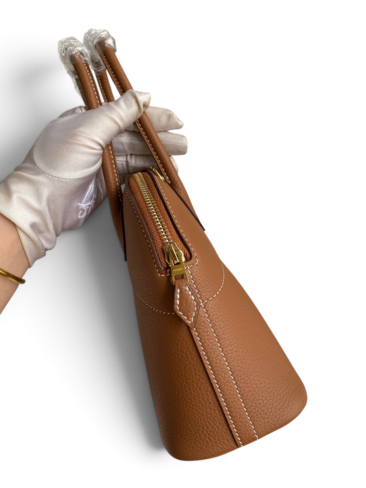SWORD LUXURY marka, taba rengi Togo deri Hermès Bolide 27cm çanta, altın donanımlı fermuar ve üst taşıma sapları.