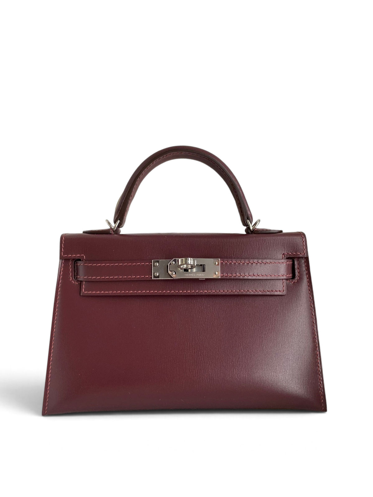 SWORD LUXURY marka, bordo renkli, kutu deri Hermès Mini Kelly 19cm çanta, gümüş donanımlı ve üstten saplı.