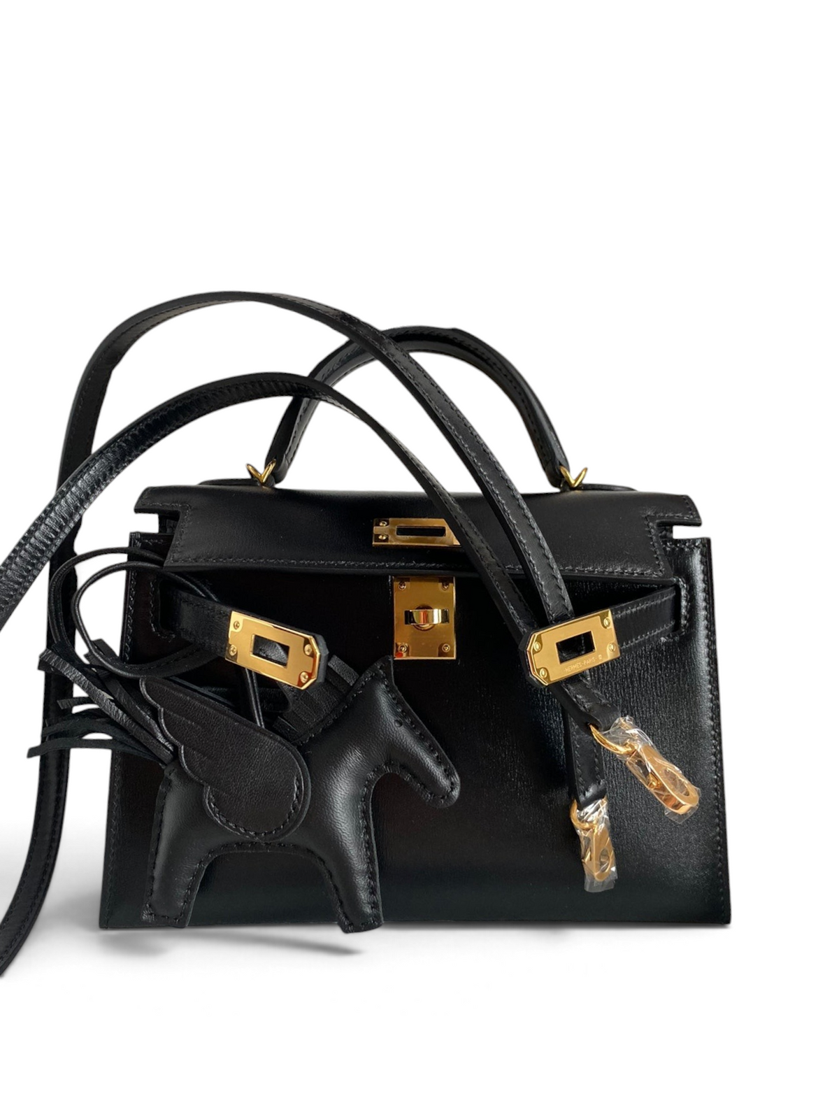 SWORD LUXURY siyah box deri 19cm Mini Kelly çanta, altın rengi donanım ve çıkarılabilir omuz askısı ile kutusunda.