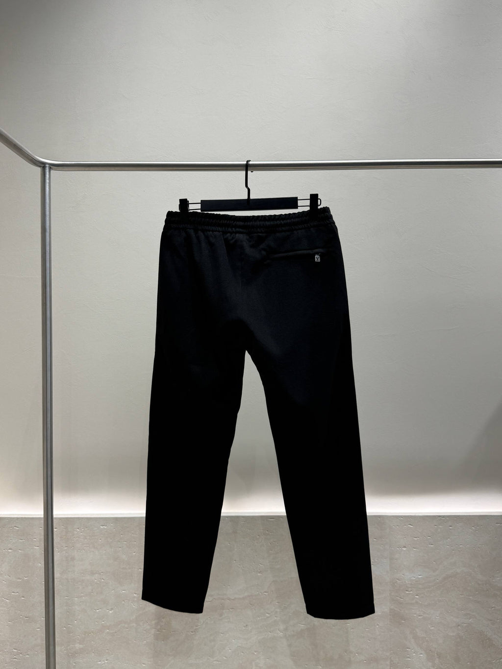Black tracksuit trousers back view