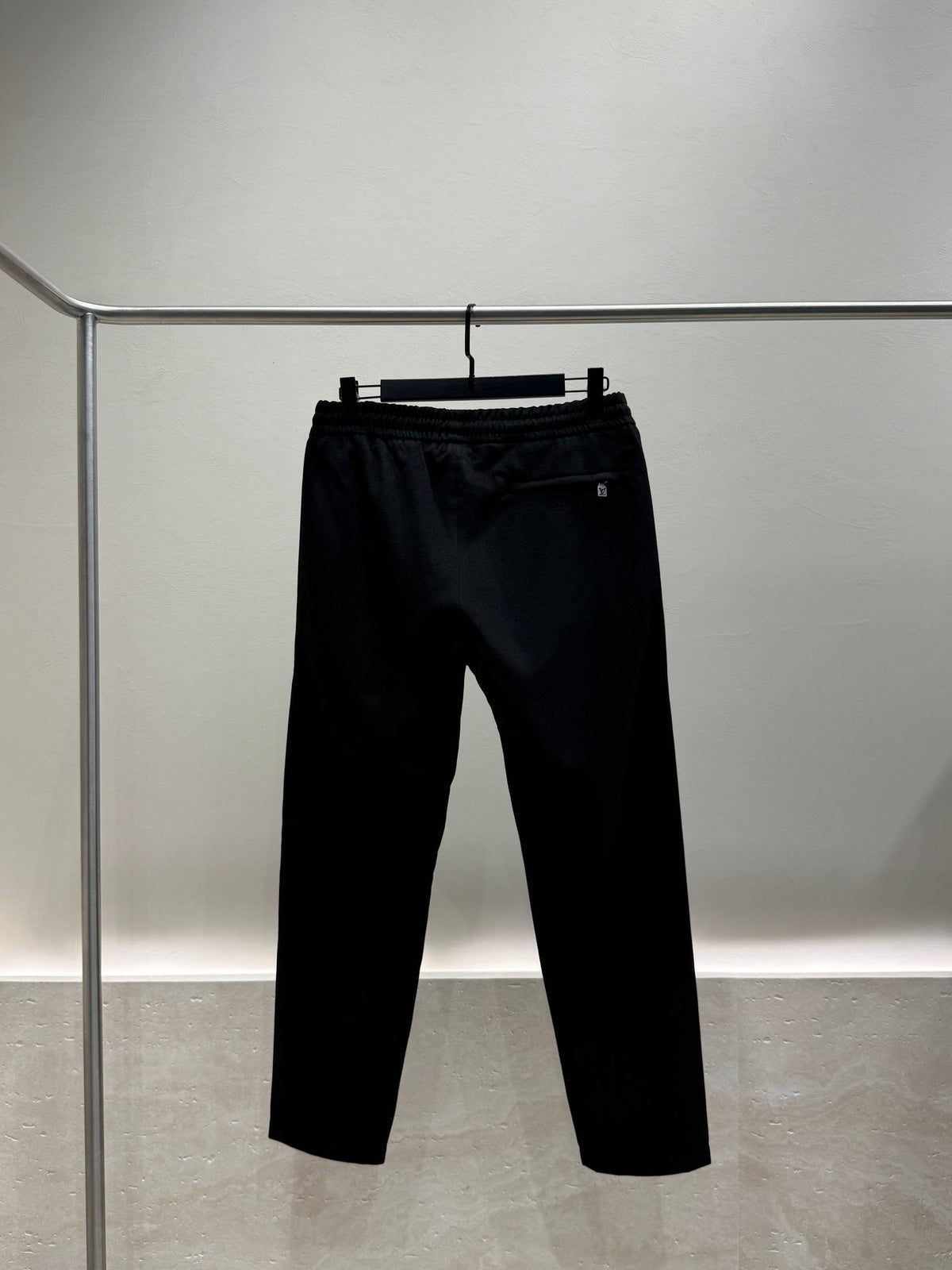 Black tracksuit trousers back view