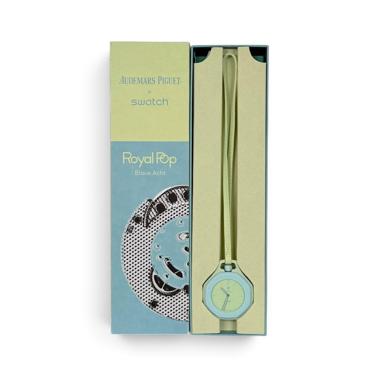 SWORD LUXURY Royal Pop saat, kutusu içinde sergilenen açık yeşil renkli, modern tasarımlı kol saati.